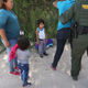 U.S. Border Patrol agents take Central American asylum seekers into custody on June 12, 2018, near McAllen, Texas. The immigrant families were then sent to a U.S. Customs and Border Protection processing center for possible separation under the Trump administration’s zero tolerance policy toward undocumented immigrants.